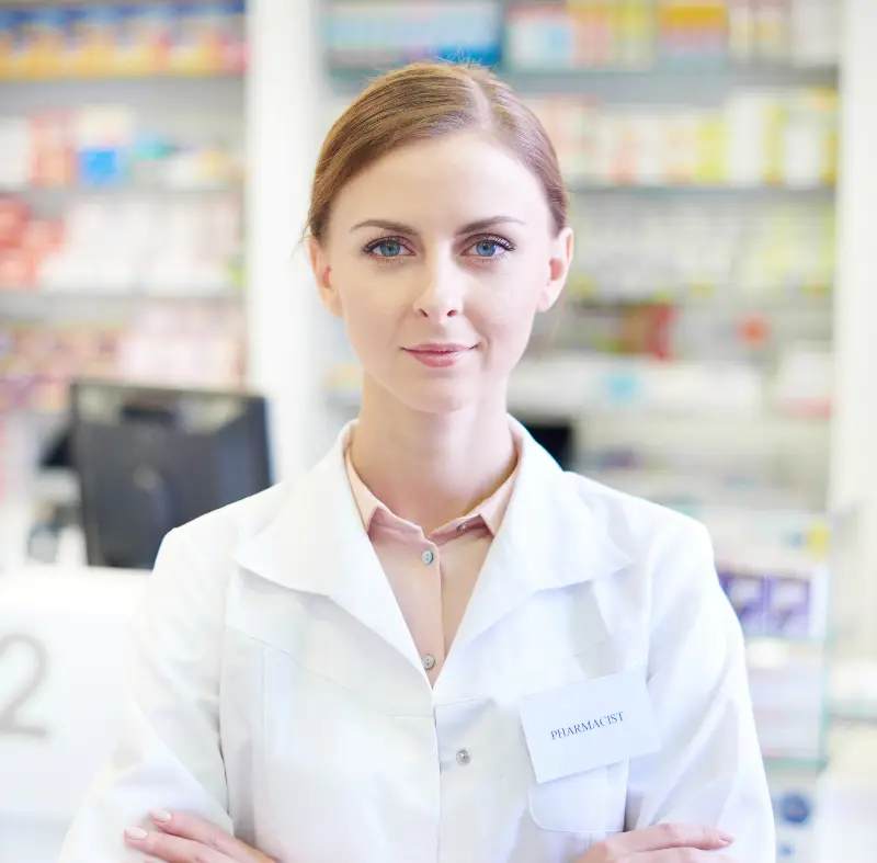 Female pharmacist with folded arms